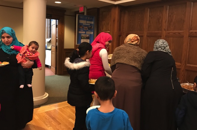 Thanksgiving dinner for refugees at St. John’s Episcopal Church, West Hartford. Photo courtesy of Rector Susan Pinkerton